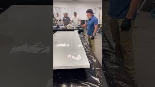 We use foam rollers to evenly spread our countertop epoxy