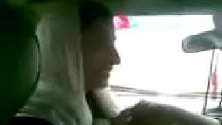 Afghani girl kissing in car