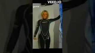 Michaela Strachan puts on a wetsuit