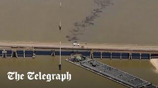 Barge hits Texas bridge and causes oil spill