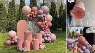 Cylinder Plinths & Balloon Garland Arch Backdrop