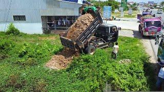 Starting a New Project Filling Flooded Pond Mini Bulldozer Pushing Soil into water with 5ton truck