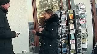 Girl smoking in front of bakery