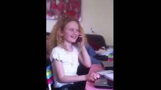 Girl laughing hysterically on the phone