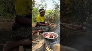 Hadzabe tribe women spend most of their time preparing bush food for tribes dinner