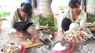 village girl cooking buff intestine fry and eating in traditional style on woodfire