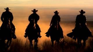 Cowboys Riding Horses At Sunset in West Desert.  Slow Motion HD & 4K Stock Video Footage