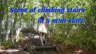 Scene of climbing stairs in a mini skirt.Tranny