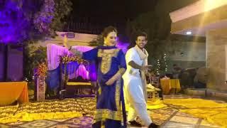 Asma Abbas and Azaan Sami Khan on the dance floor at a engagement ceremony.