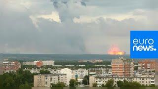 Spectacular explosions after fire at Russian arms depot in Siberia