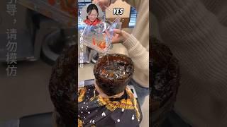 Chinese Woman Styles Hair into FISHTANK  