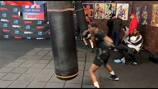 BRUCE SHU SHU CARRINGTON UNLOADING BIG SHOTS ON THE HEAVY BAG IN CAMP FOR APRIL 8TH  TRAINING