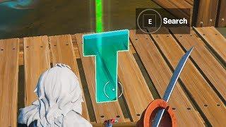 Search the hidden T in the Trick Shot Loading Screen Fortnite location