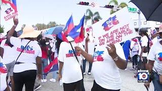 Protestors march in North Miami against the humanitarian crisis in Haiti