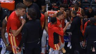 Bogdan Bogdanovic gets heated with coach on Hawks bench and needs to be held back 
