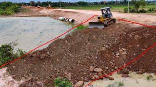 Excellent skillful dozer operator pushing dirt rock to build the road for farmer easy to carry rice