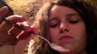 Girl eats grasshopper