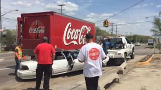 Woman injured in collison with Coca-Cola truck