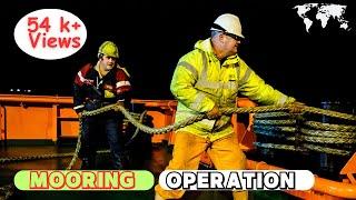 Mooring operation. Mooring and berthing a giant ship.. Berthing a ship.