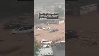 Cars carried away by Beijing flood