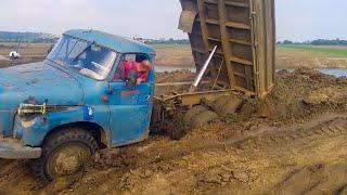 Heavy Truck Got Stuck in Mud Dump Trucks and Timber Trucks Work in Mud and Off-Road Conditions