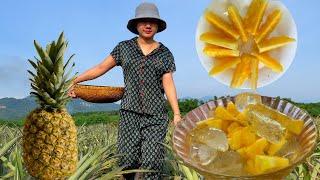 The village girl is making delicious pineapple dishes in her kitchen cooling summer dish