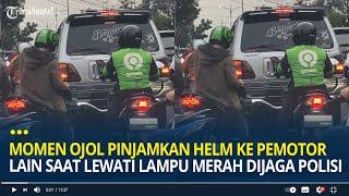 Viral Momen Ojol Pinjamkan Helm ke Pemotor Lain Saat Lewati Lampu Merah yang Dijaga Polisi