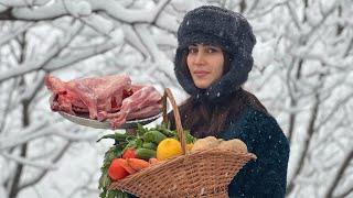 Cooking tandoori lamb with saffron and vegetables on a snowy winter day