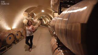 Why do California wineries build wine caves?