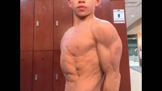 Little boy shows his abs