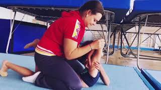 Coach painfully pops shoulder of young gymnast