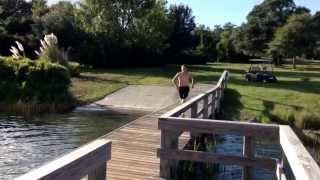 Guy Jumps Ledge Of Dock