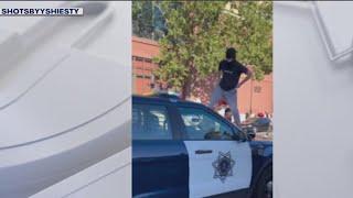 Masked spectators stomp attack San Jose police car after sideshow  KTVU