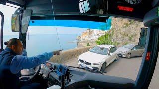 Bus drive narrow cliff road Italy