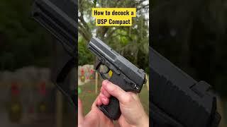 How do you decock a USP Compact pistol? drop hammer without firing