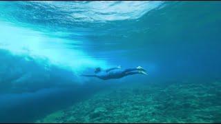 BELOW - Under Teahupoo The Mythic Wave with World Free diving champion ARNAULT JERALD
