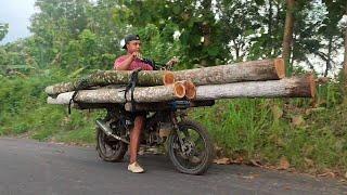 they transported lots of wood using modified motorbikes