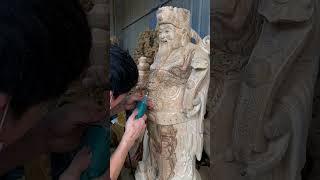 Carving the God of Wealth Wood Statue