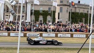 Mika Hakkinen McLaren MP413 formula one car drive past at the Goodwood Festival of Speed 2023