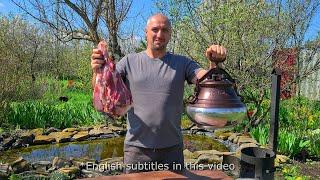 Cooking Uzbek pilaf with lamb in an Afghan cauldron.