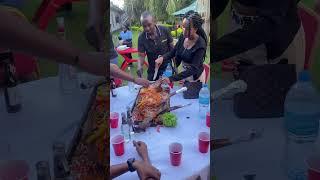 Gathering around the table delighting in the flavors of freshly grilled BBQ goat