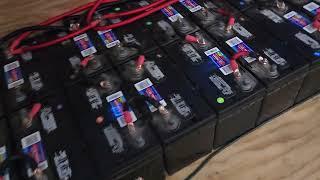 28 Walmart batteries for 38304 Kwh total power with balanced changing. Off grid living on a budget.