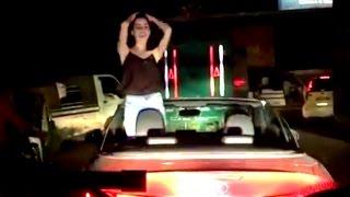 Beautiful Indian girl dancing in open car.LATEST