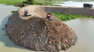 Amazing Project Bulldozers Creating a New Road on a Large River Spreading by Truck and Pushing Soil