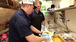 Making burritos and taking orders Nate Eaton is workin’ it at Rusty Taco