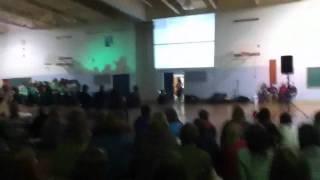 Kid streaks during Christmas assembly
