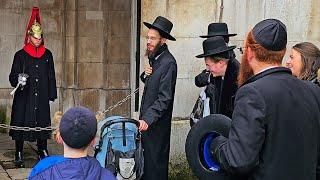 REGULAR BAND OF RUDE IDIOTS TURN UP TO ANNOY AND MOCK THE KINGS GUARD at Horse Guards