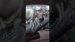 Airbrushing skulls on Harley Davidson tank
