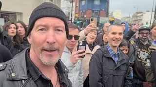 Bono & the Edge invited to sing with street buskers in London.  Or are they tribute artists?