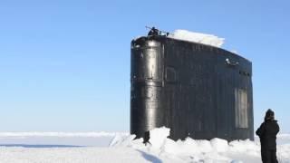 Navy Submarine Breaks Through Ice in the Arctic Circle